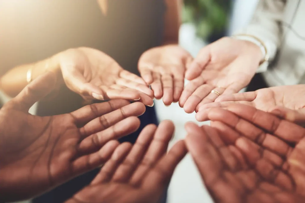 a cirle of hands touching