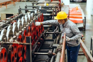 Professional senior engineer working, Expert technician worker checking machine in plant factory. stock photo
