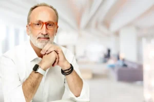 man wearing glasses looking contemplative